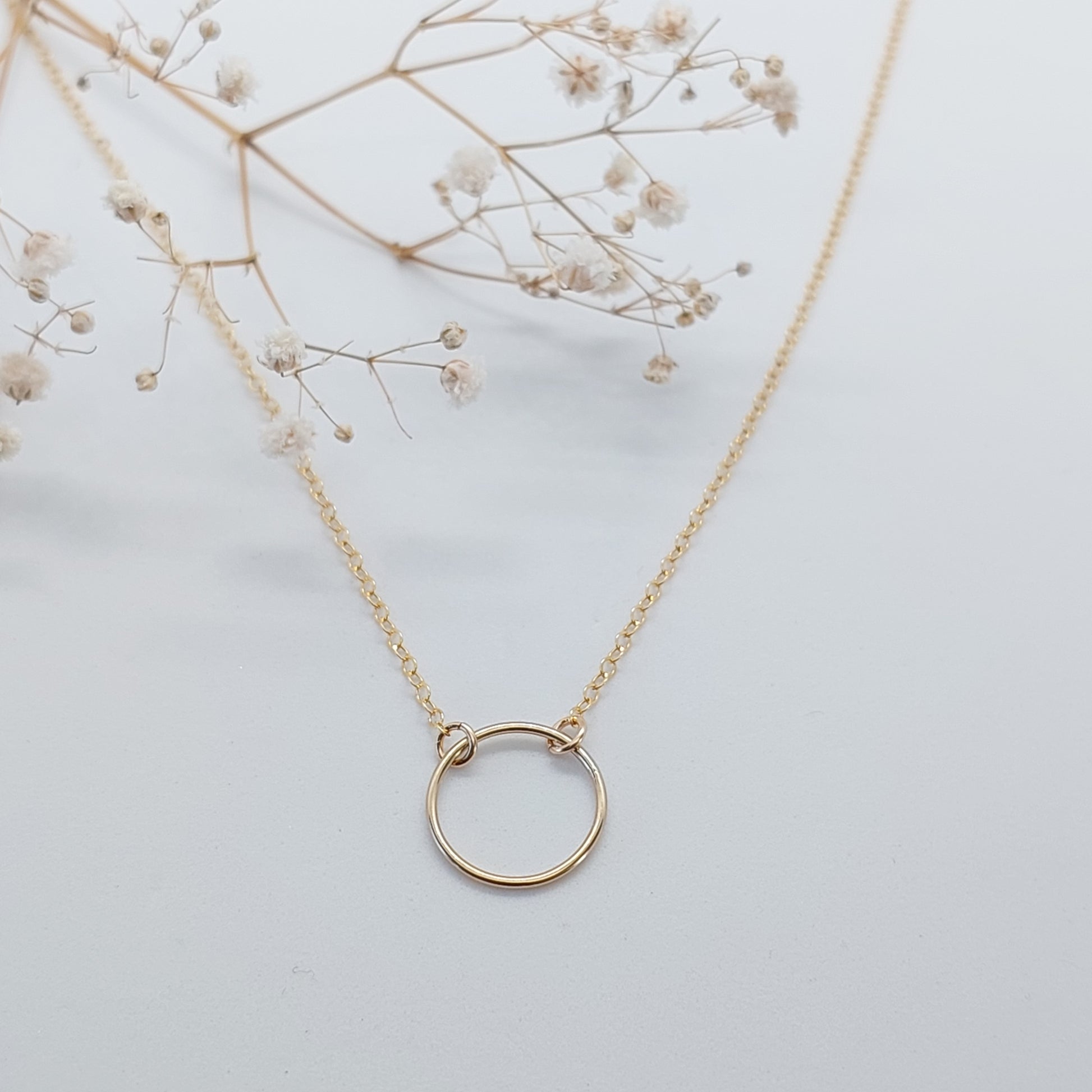 Sparkly chain necklace with a circle in the front. Lobster Clasp at the back. Available in Sterling Silver and 14k Gold Filled