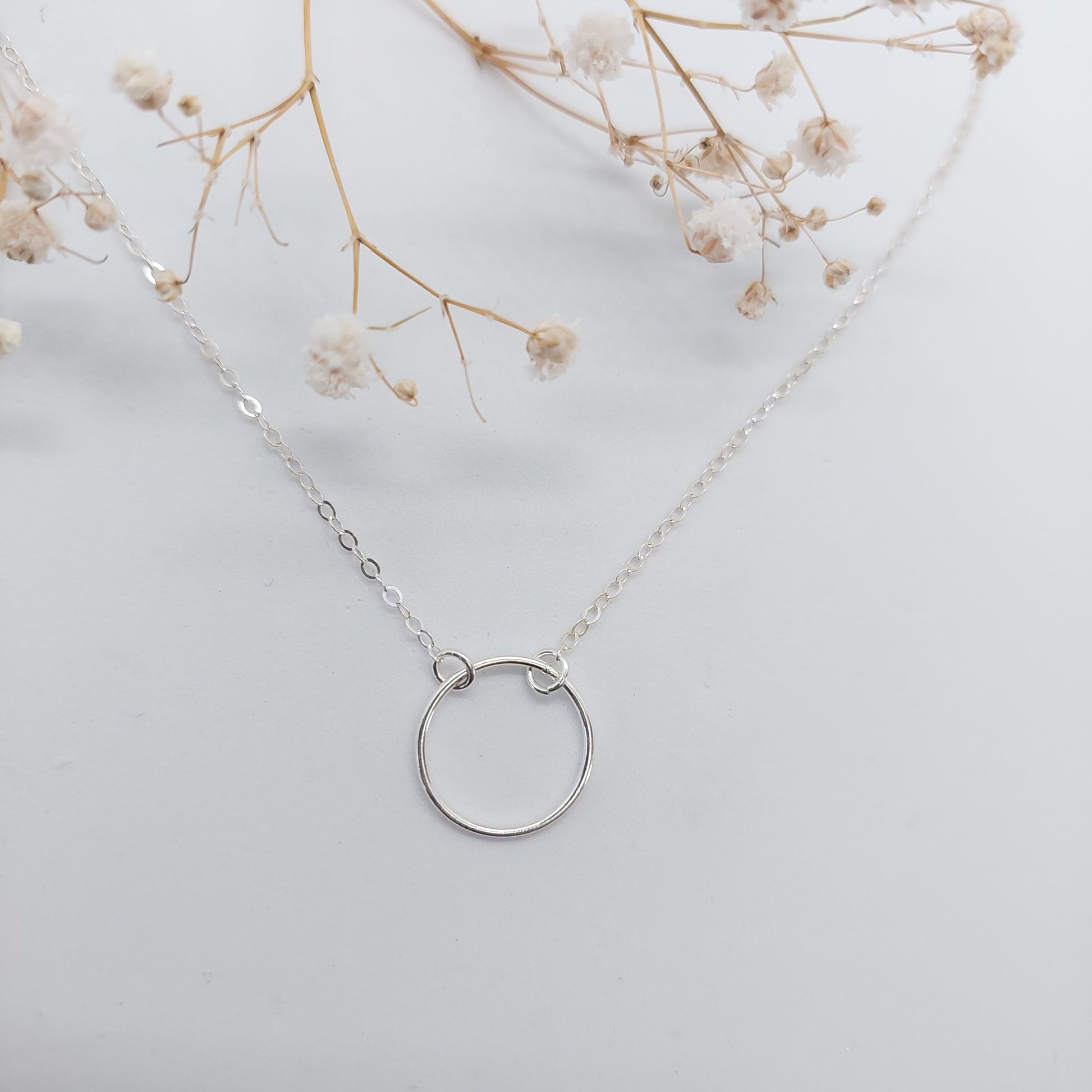 Sparkly chain necklace with a circle in the front. Lobster Clasp at the back. Available in Sterling Silver and 14k Gold Filled