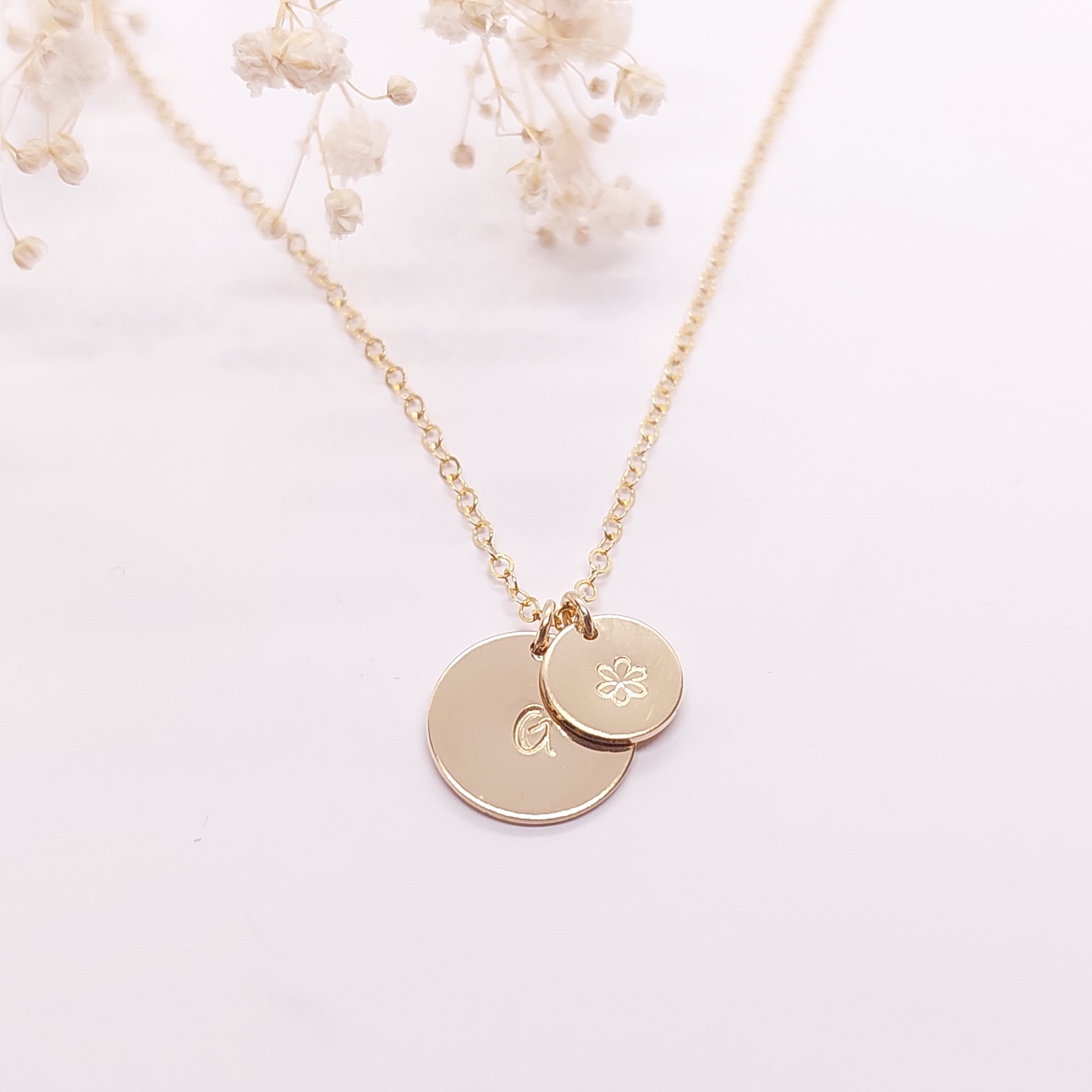 Midi and small disc necklace with an initial and flower hand stamped onto it. Personalised jewellery NZ. Sterling Silver, Gold fill and Rose Gold Fill. Personalised gift NZ. Hand stamped jewellery NZ. Custom made gift