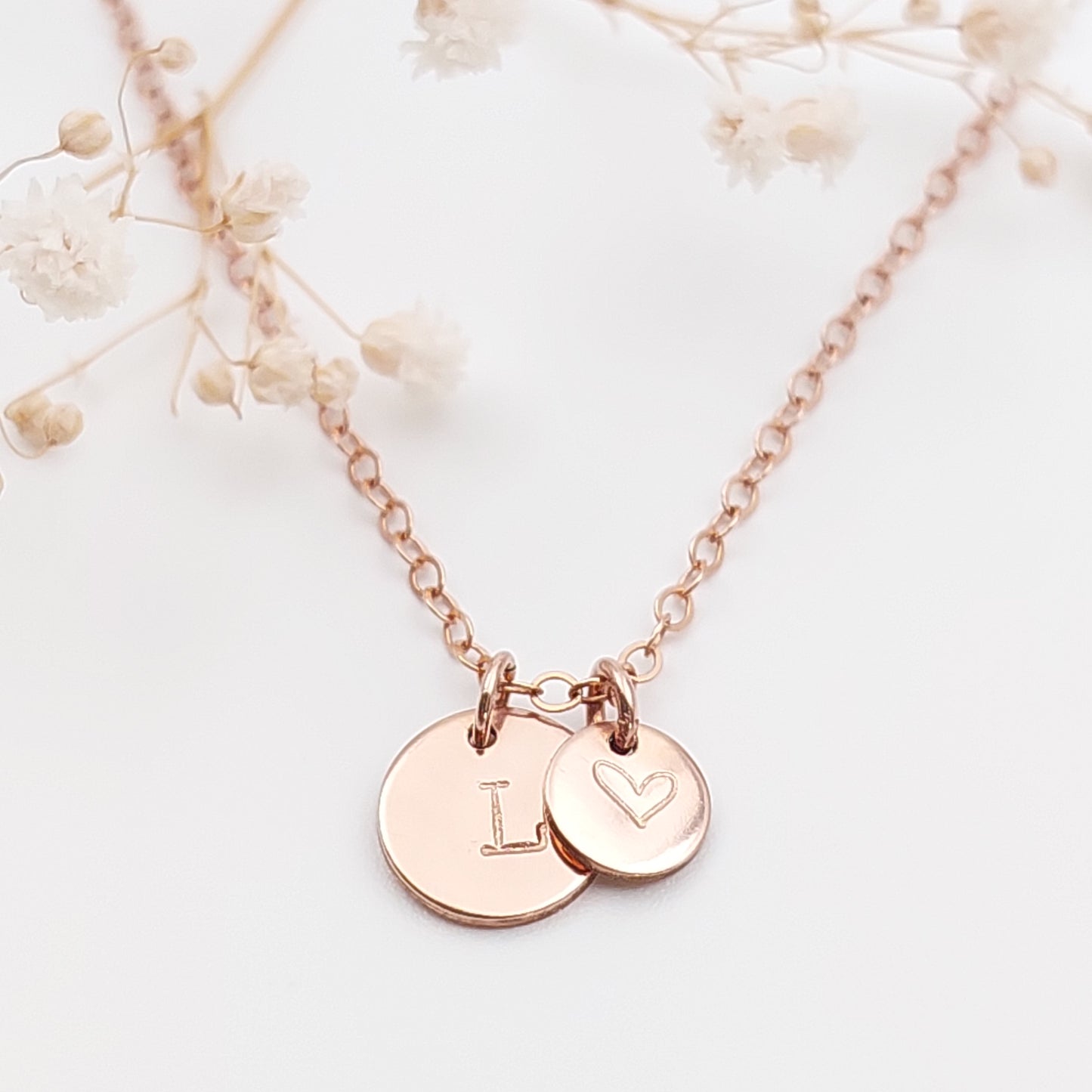 Midi and small disc necklace with an initial and heart hand stamped onto it. Personalised jewellery NZ. Sterling Silver, Gold Filled, Rose Gold Filled. Personalised gift NZ. Hand stamped jewellery NZ. Custom made gift