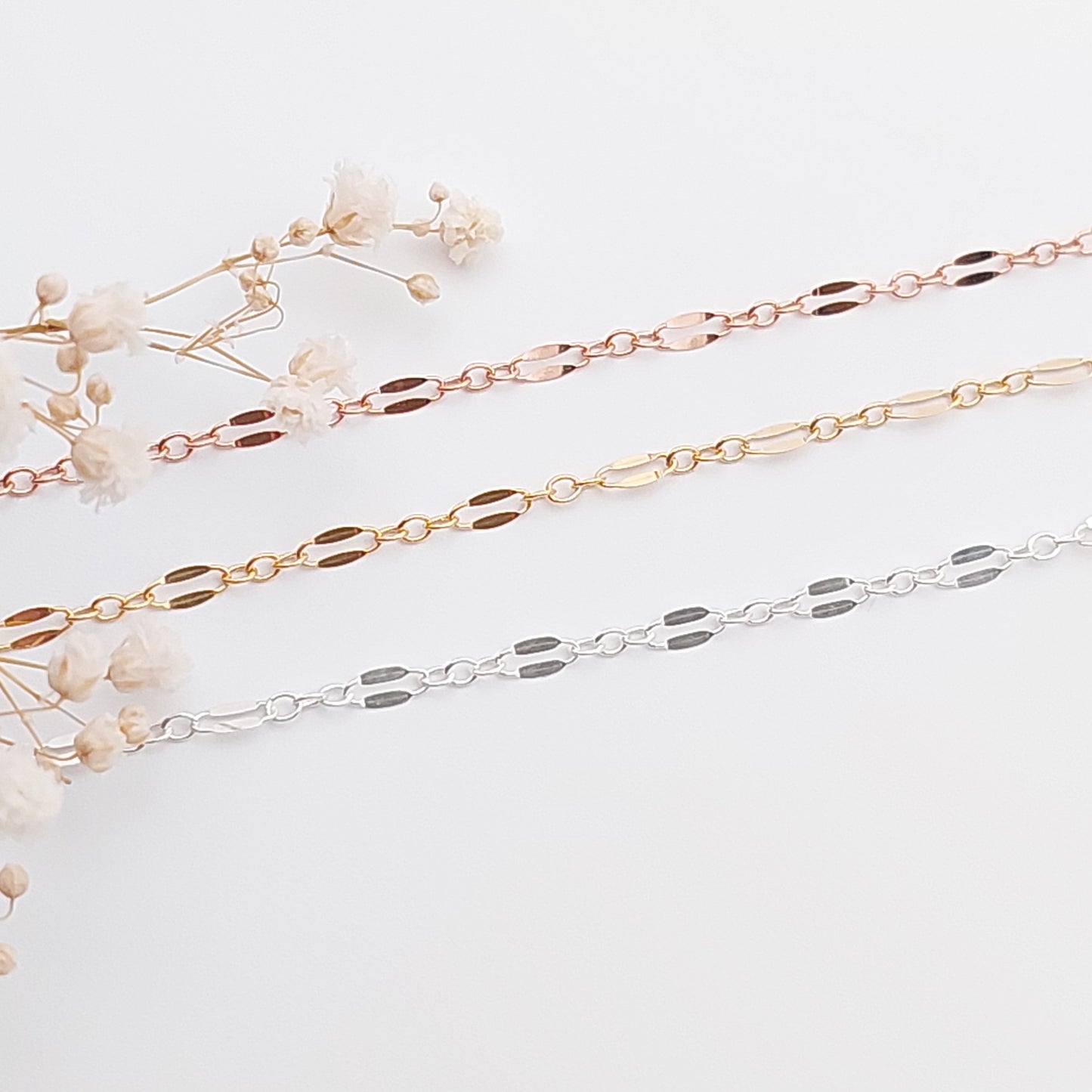 Beautiful sparkly chain consisting of long and short links. Lace like chain available is Sterling Silver, 14k Gold Filled and 14K Rose Gold Filled